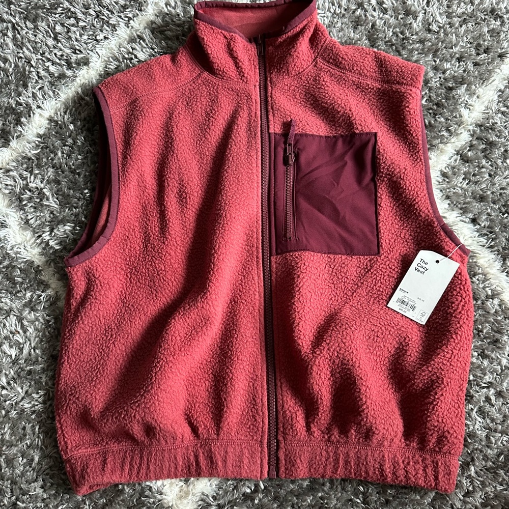 red Sherpa vest.